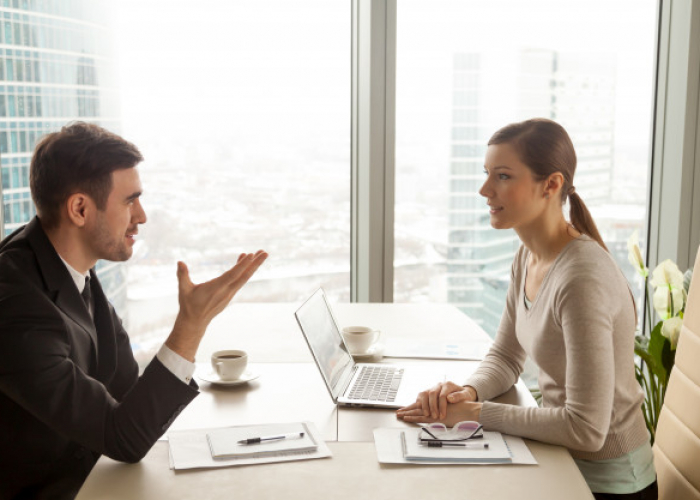 businessman-businesswoman-discussing-work-office-desk_1163-5351