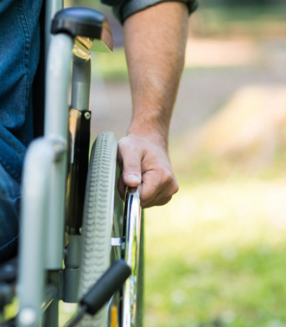 detail-man-using-wheelchair-park-copy-space-right-side_53419-4079