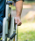 detail-man-using-wheelchair-park-copy-space-right-side_53419-4079